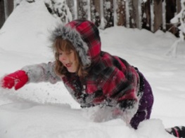 Girl playing in snow